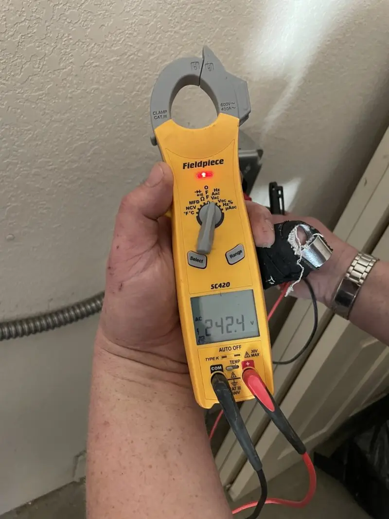 Voltage testing with clamp meter during Aluminum Wiring Replacement in Harvey